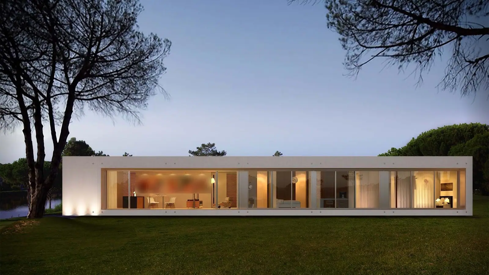 Casa de una planta con todo el frente de vidrio y las luces encendidas, al anochecer